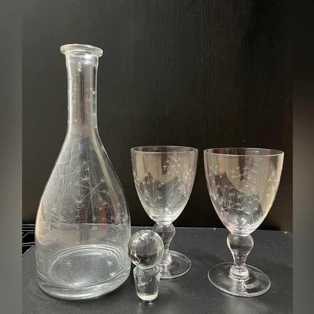 Decanter and two goblets with star design.